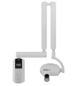 Dental panoramic X-ray machine with vertical arms and control panel, used for taking dental radiographs.