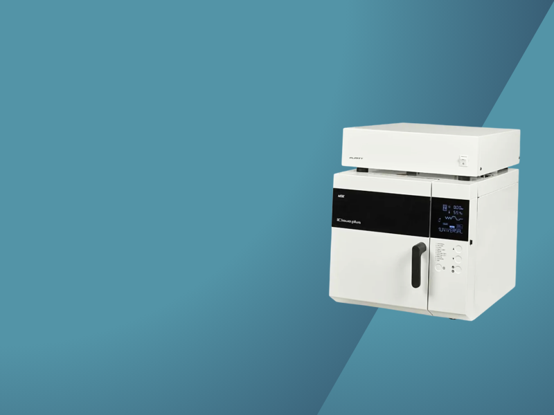 White benchtop laboratory instrument with a digital display and vertical door handle against teal background.